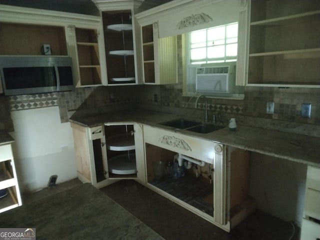 390 Burg Rd, Locust Grove, GA 30248 - kitchen featuring stainless steel microwave, a sink, backsplash, open shelves, and cooling unit