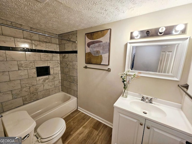 2977 5th St SW, Atlanta, GA 30315 - full bathroom with vanity, wood finished floors, a textured ceiling, and washtub / shower combination