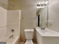 426 Summer Hill Cir, Stockbridge, GA 30281 - full bathroom featuring vanity, toilet, and tub / shower combination