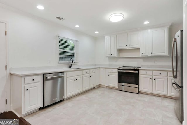 1245 Ladd St SW, Atlanta, GA 30310 - kitchen featuring appliances with stainless steel finishes, white cabinetry, recessed lighting, light countertops, and open shelves