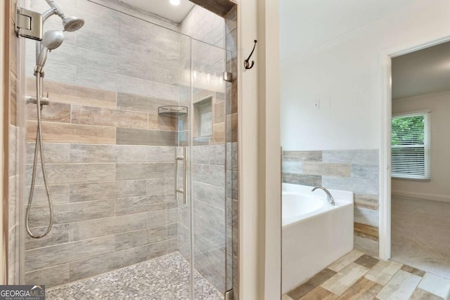 1245 Ladd St SW, Atlanta, GA 30310 - bathroom with a bath, a shower stall, and ornamental molding