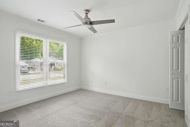 1245 Ladd St SW, Atlanta, GA 30310 - empty room with ceiling fan, ornamental molding, and light colored carpet