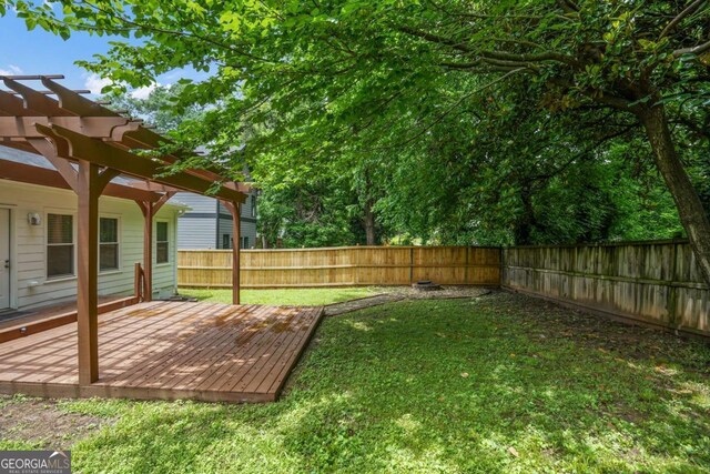 1245 Ladd St SW, Atlanta, GA 30310 - fenced backyard with a pergola and a wooden deck