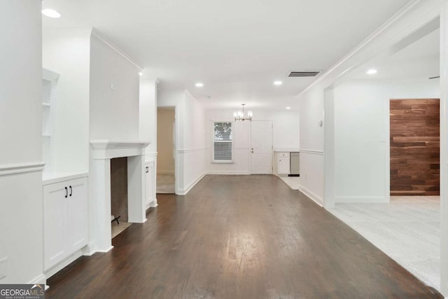 1245 Ladd St SW, Atlanta, GA 30310 - unfurnished living room featuring a chandelier, recessed lighting, wood finished floors, and crown molding