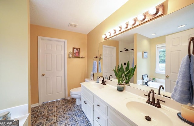 1010 Calls Creek Cir, Watkinsville, GA 30677 - bathroom with a bath, double vanity, toilet, a shower, and baseboards