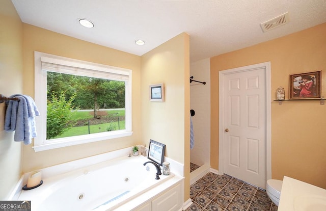 1010 Calls Creek Cir, Watkinsville, GA 30677 - full bath with a jetted tub, a shower, toilet, recessed lighting, and baseboards