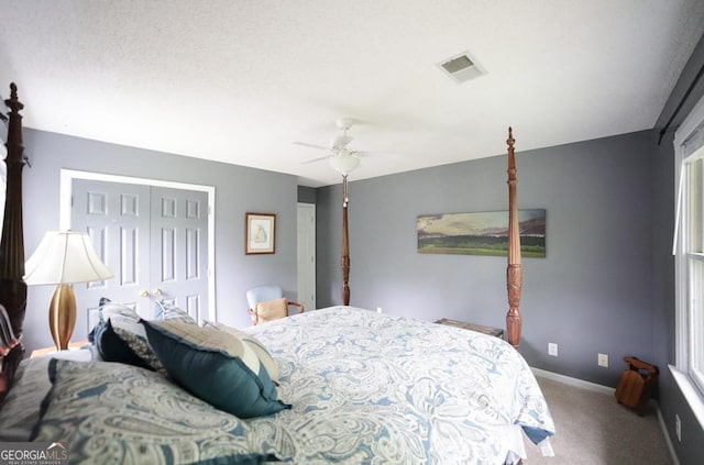 1010 Calls Creek Cir, Watkinsville, GA 30677 - carpeted bedroom featuring a closet, ceiling fan, and baseboards