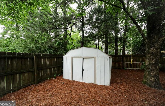 1010 Calls Creek Cir, Watkinsville, GA 30677 - view of shed with a fenced backyard