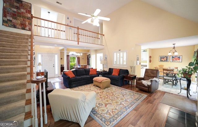 1010 Calls Creek Cir, Watkinsville, GA 30677 - living room featuring a chandelier, stairs, high vaulted ceiling, wood finished floors, and ceiling fan