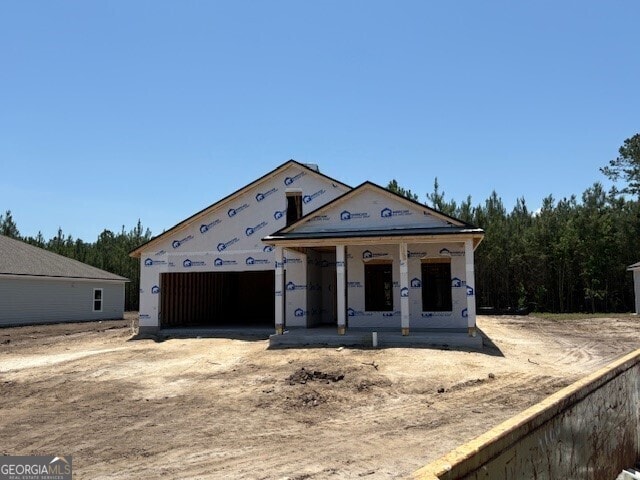 205 Park View Ln, Kingsland, GA 31548 - property under construction with a garage, a porch, and driveway