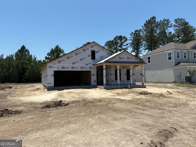 205 Park View Ln, Kingsland, GA 31548 - property under construction with a porch, central air condition unit, and an attached garage