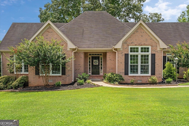10 Wigwam Cir, Whitesburg, GA 30185 - view of front facade featuring brick siding, a front yard, and roof with shingles