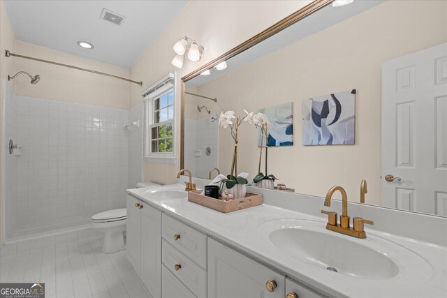 10 Wigwam Cir, Whitesburg, GA 30185 - full bath featuring tile patterned floors, double vanity, and tiled shower