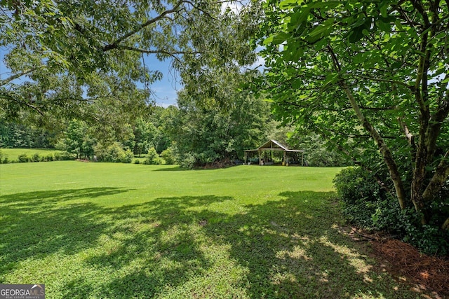 10 Wigwam Cir, Whitesburg, GA 30185 - view of grassy yard featuring a gazebo and view of scattered trees