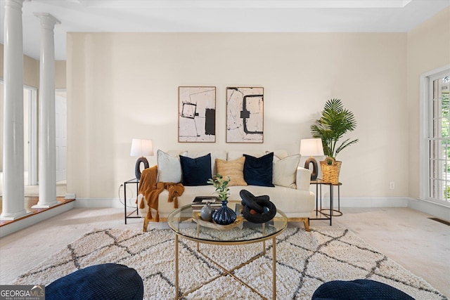 10 Wigwam Cir, Whitesburg, GA 30185 - carpeted living room featuring ornate columns and plenty of natural light