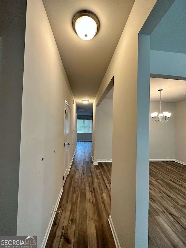 2832 Saratoga Lake Vw, Decatur, GA 30034 - corridor with wood finished floors, baseboards, and a chandelier