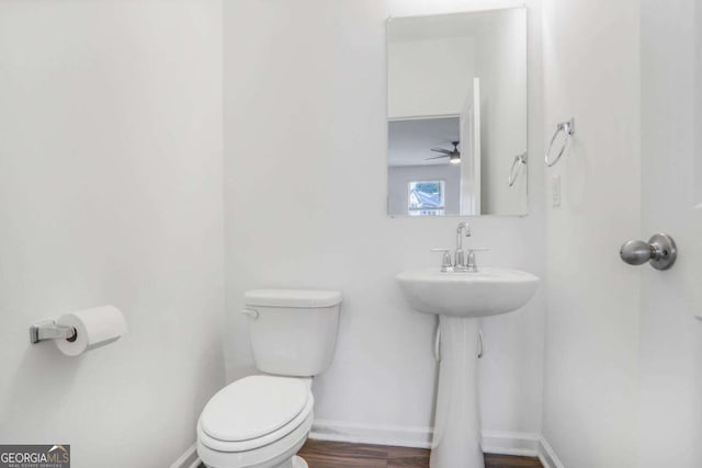 3848 Hester St, Duluth, GA 30097 - half bath with wood finished floors and a ceiling fan