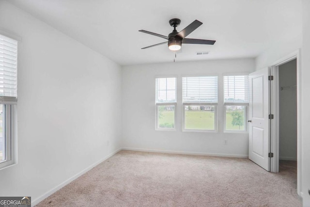 3848 Hester St, Duluth, GA 30097 - unfurnished bedroom with light colored carpet and a ceiling fan