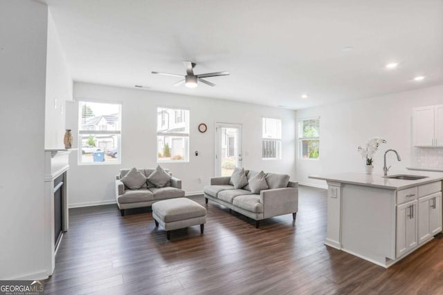 3848 Hester St, Duluth, GA 30097 - living room with a ceiling fan, dark wood-type flooring, a fireplace, and recessed lighting