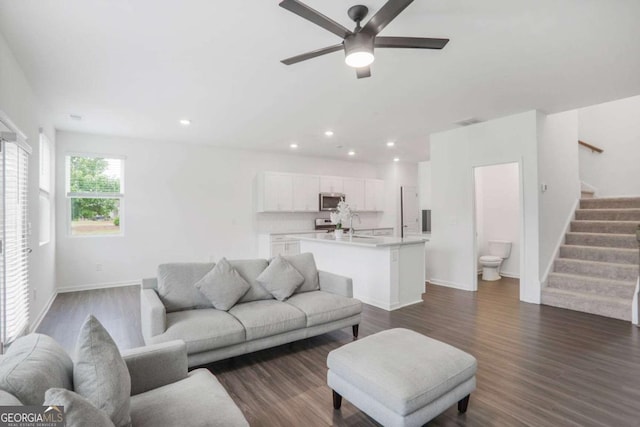 3848 Hester St, Duluth, GA 30097 - living area featuring ceiling fan, stairs, dark wood-style floors, and recessed lighting