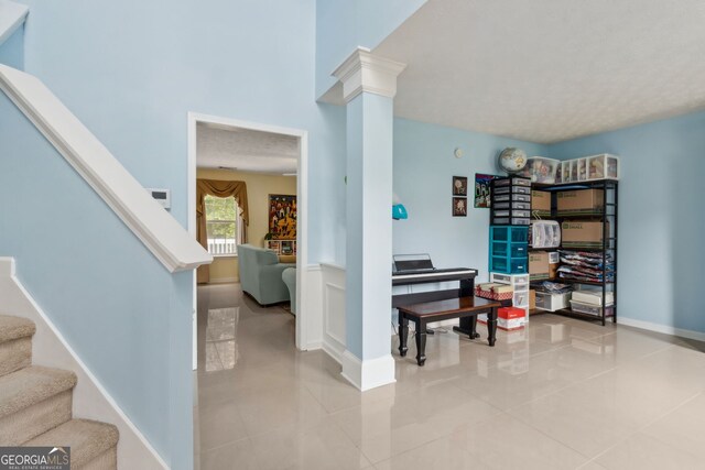 570 White Stag Ct, Suwanee, GA 30024 - entryway featuring stairs, decorative columns, and light tile patterned floors
