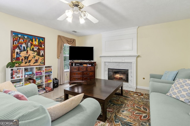 570 White Stag Ct, Suwanee, GA 30024 - living room featuring ceiling fan and a high end fireplace