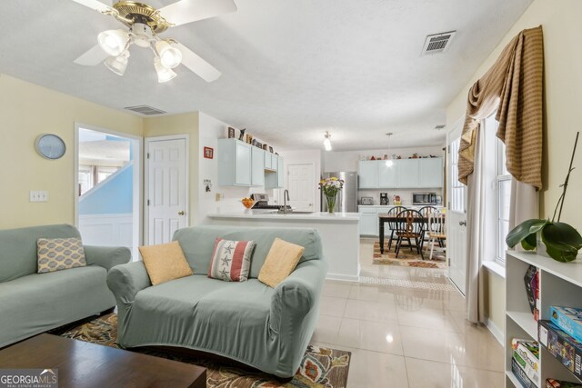 570 White Stag Ct, Suwanee, GA 30024 - living area featuring ceiling fan and light tile patterned flooring