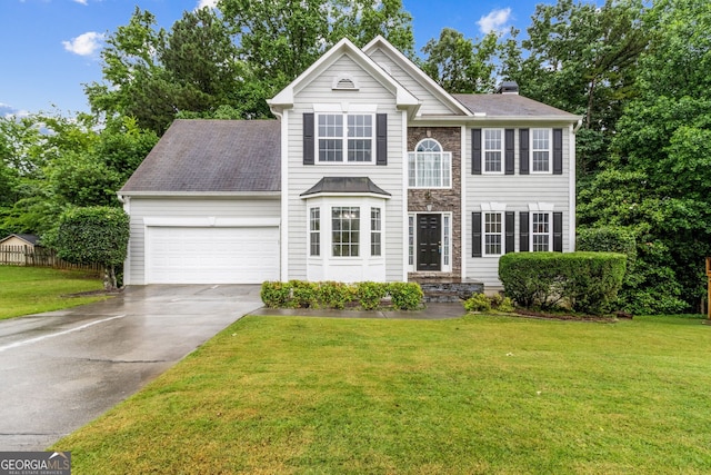 570 White Stag Ct, Suwanee, GA 30024 - view of front of property with a garage, driveway, and a chimney
