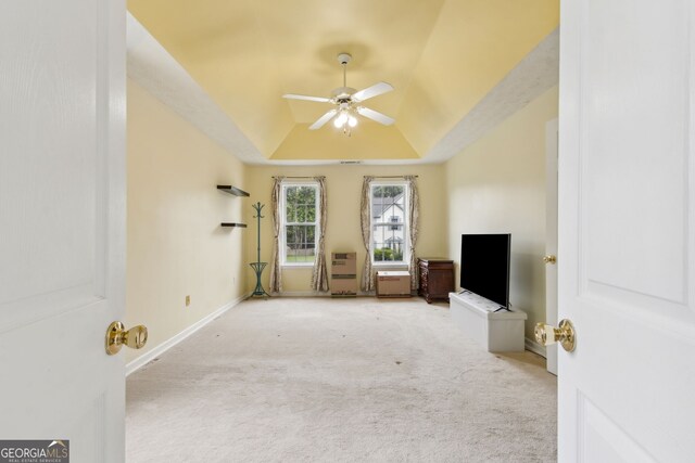 570 White Stag Ct, Suwanee, GA 30024 - unfurnished living room featuring ceiling fan, a raised ceiling, and carpet flooring