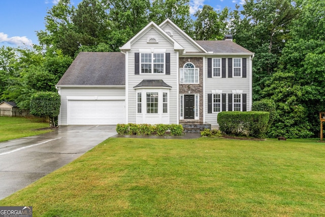 570 White Stag Ct, Suwanee, GA 30024 - view of front of house with an attached garage, concrete driveway, and a chimney