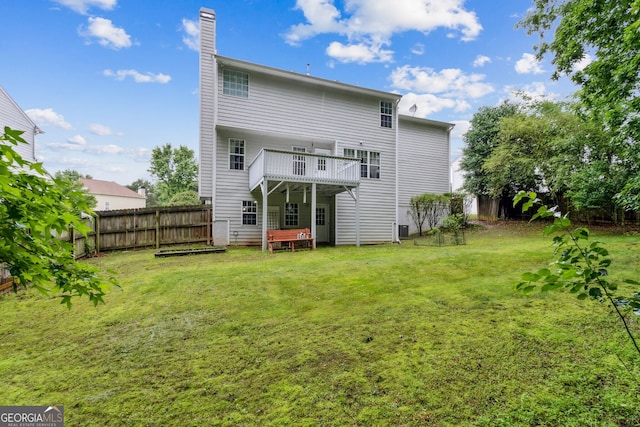 570 White Stag Ct, Suwanee, GA 30024 - rear view of house featuring a fenced backyard, a chimney, and a deck