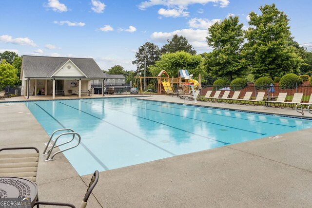 570 White Stag Ct, Suwanee, GA 30024 - community pool featuring a patio