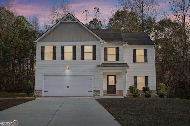 382 Daffodil Dr, Temple, GA 30179 - view of front of property featuring an attached garage, concrete driveway, and board and batten siding