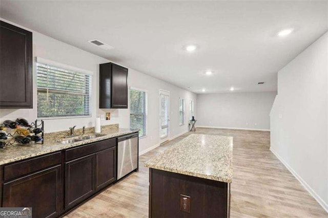 382 Daffodil Dr, Temple, GA 30179 - kitchen with dishwasher, plenty of natural light, open floor plan, light wood-style flooring, and recessed lighting