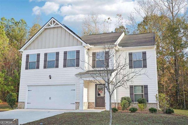 382 Daffodil Dr, Temple, GA 30179 - view of front of home with an attached garage, board and batten siding, driveway, and roof with shingles