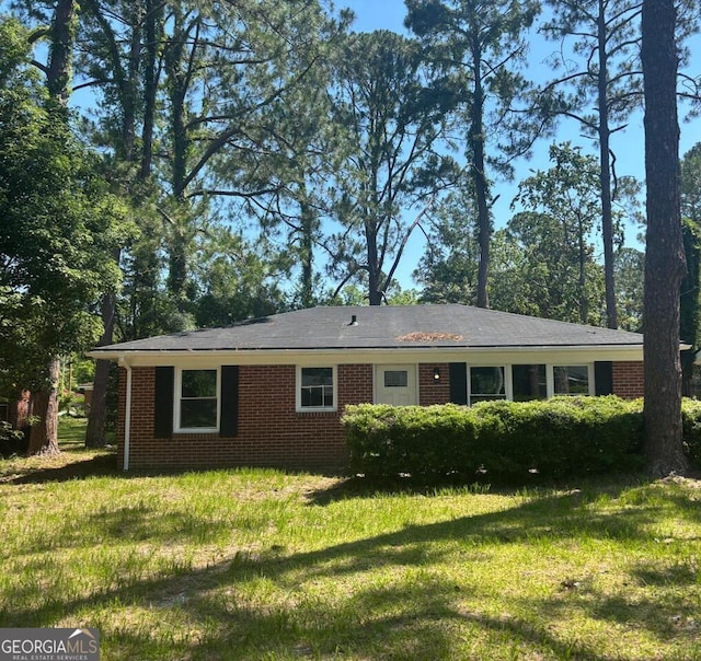 1408 Bethune St, Waycross, GA 31501 - view of front of home with brick siding and a front lawn