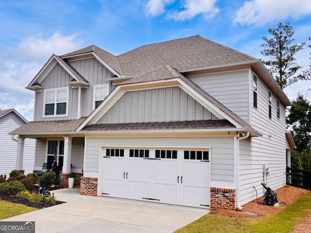 38 Lavender Ct, Dallas, GA 30132 - craftsman-style house featuring board and batten siding, concrete driveway, a porch, roof with shingles, and brick siding