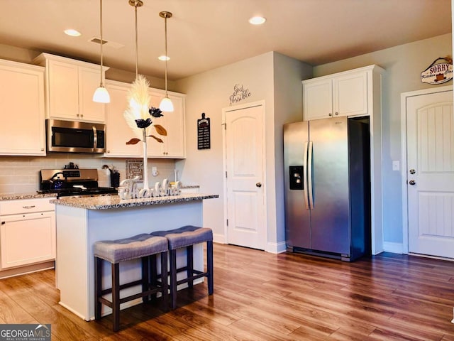 38 Lavender Ct, Dallas, GA 30132 - kitchen featuring stainless steel appliances, backsplash, light stone counters, and recessed lighting