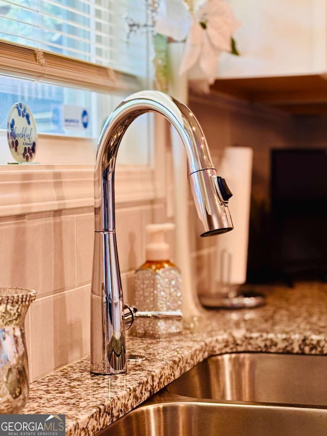 38 Lavender Ct, Dallas, GA 30132 - kitchen view of a sink and light stone counters