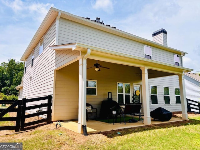 38 Lavender Ct, Dallas, GA 30132 - back of property featuring ceiling fan, a patio, and a chimney