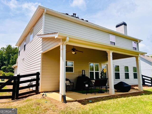 38 Lavender Ct, Dallas, GA 30132 - rear view of house with a ceiling fan, a patio area, and a chimney