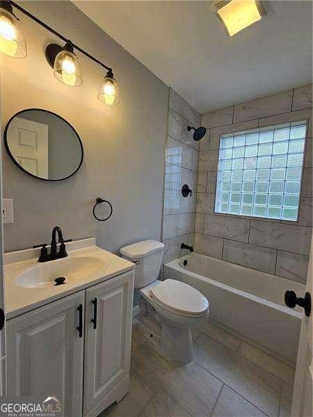 766 Longleaf Dr, Forest Park, GA 30297 - full bath with vanity, toilet, washtub / shower combination, and tile patterned floors