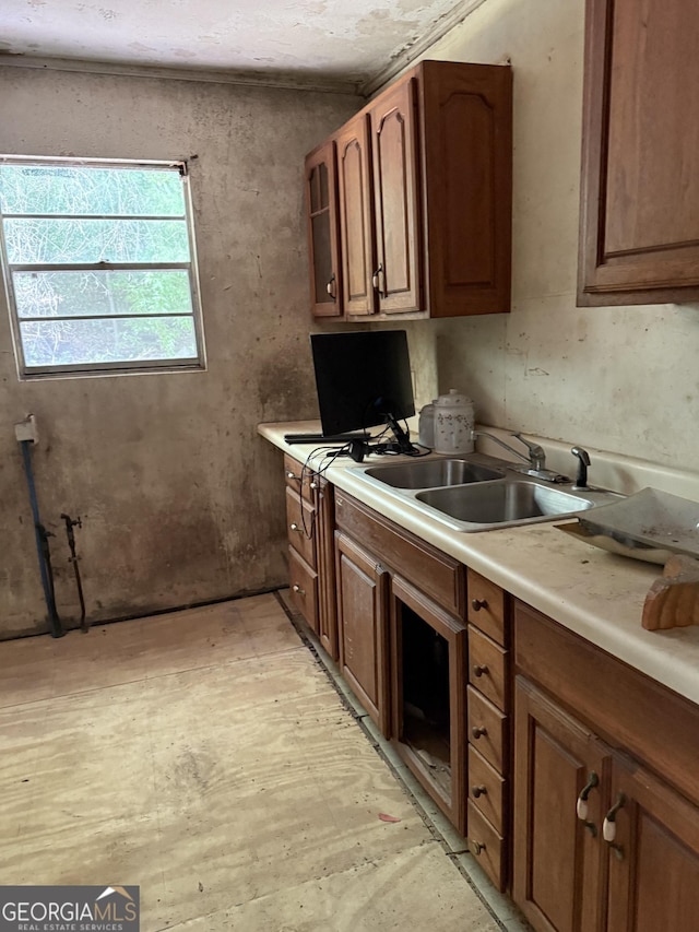 895 Ell Ct, Macon, GA 31206 - kitchen with light countertops and brown cabinets