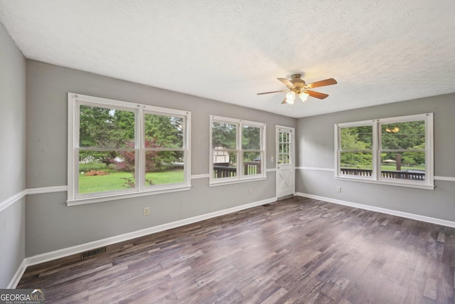 2676 Abington Dr, Snellville, GA 30078 - spare room with a ceiling fan, wood finished floors, baseboards, and a textured ceiling