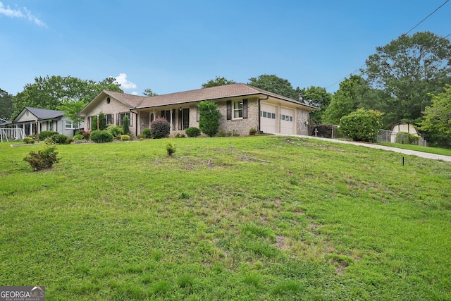 2676 Abington Dr, Snellville, GA 30078 - ranch-style house with a garage, a front yard, brick siding, and driveway