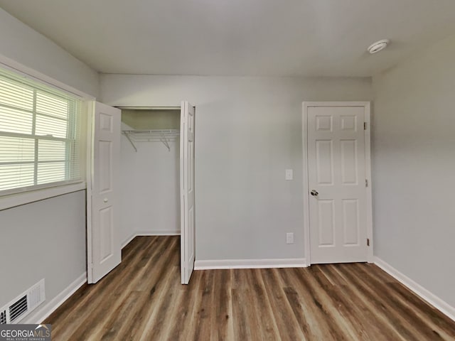 7054 Chappell Cir, Atlanta, GA 30360 - unfurnished bedroom featuring wood finished floors, a closet, and baseboards