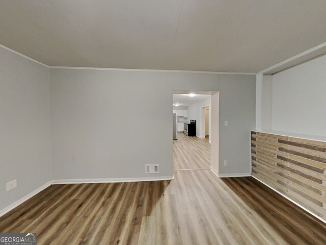 7054 Chappell Cir, Atlanta, GA 30360 - empty room with wood finished floors, ornamental molding, and baseboards