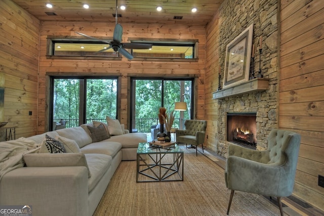 968 Hidden Valley Dr, Morganton, GA 30560 - living room with ceiling fan, a fireplace, wood walls, recessed lighting, and wood finished floors