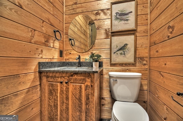 968 Hidden Valley Dr, Morganton, GA 30560 - bathroom featuring wood walls, vanity, and toilet