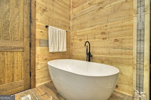 968 Hidden Valley Dr, Morganton, GA 30560 - full bath featuring wooden walls, a freestanding tub, and wood finished floors